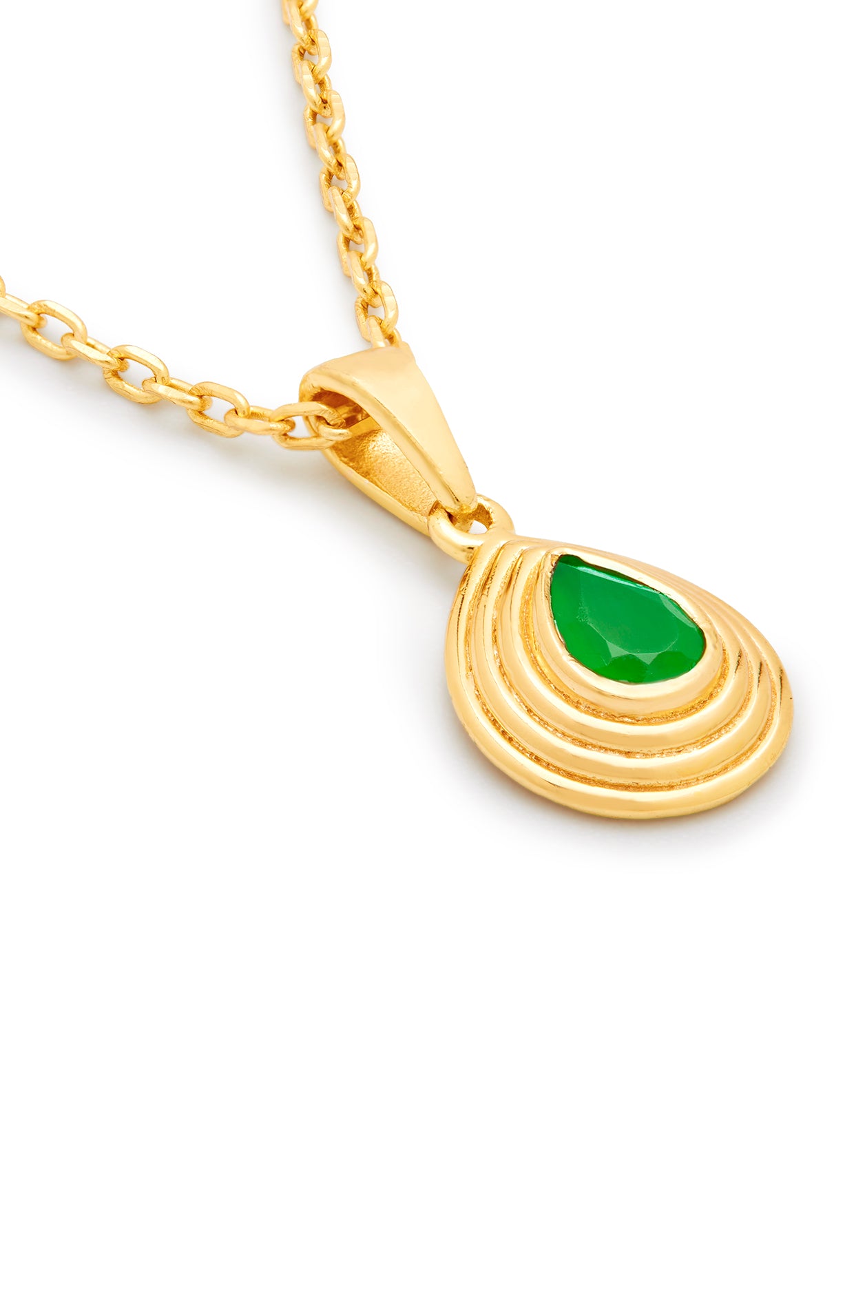 Gold teardrop pendant on a gold chain with a green onyx gemstone on a white backgroundund