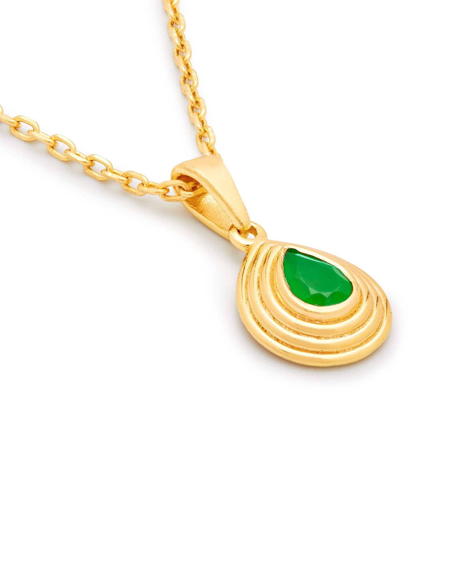 Gold teardrop pendant on a gold chain with a green onyx gemstone on a white backgroundund