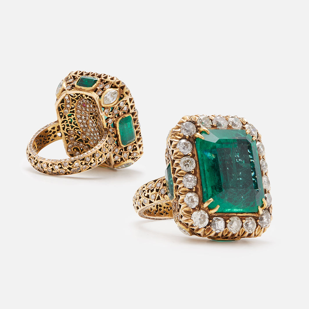 Ring with large dark emerald in our signature jali setting with a hidden parrot motif set in 18K yellow gold and diamonds
