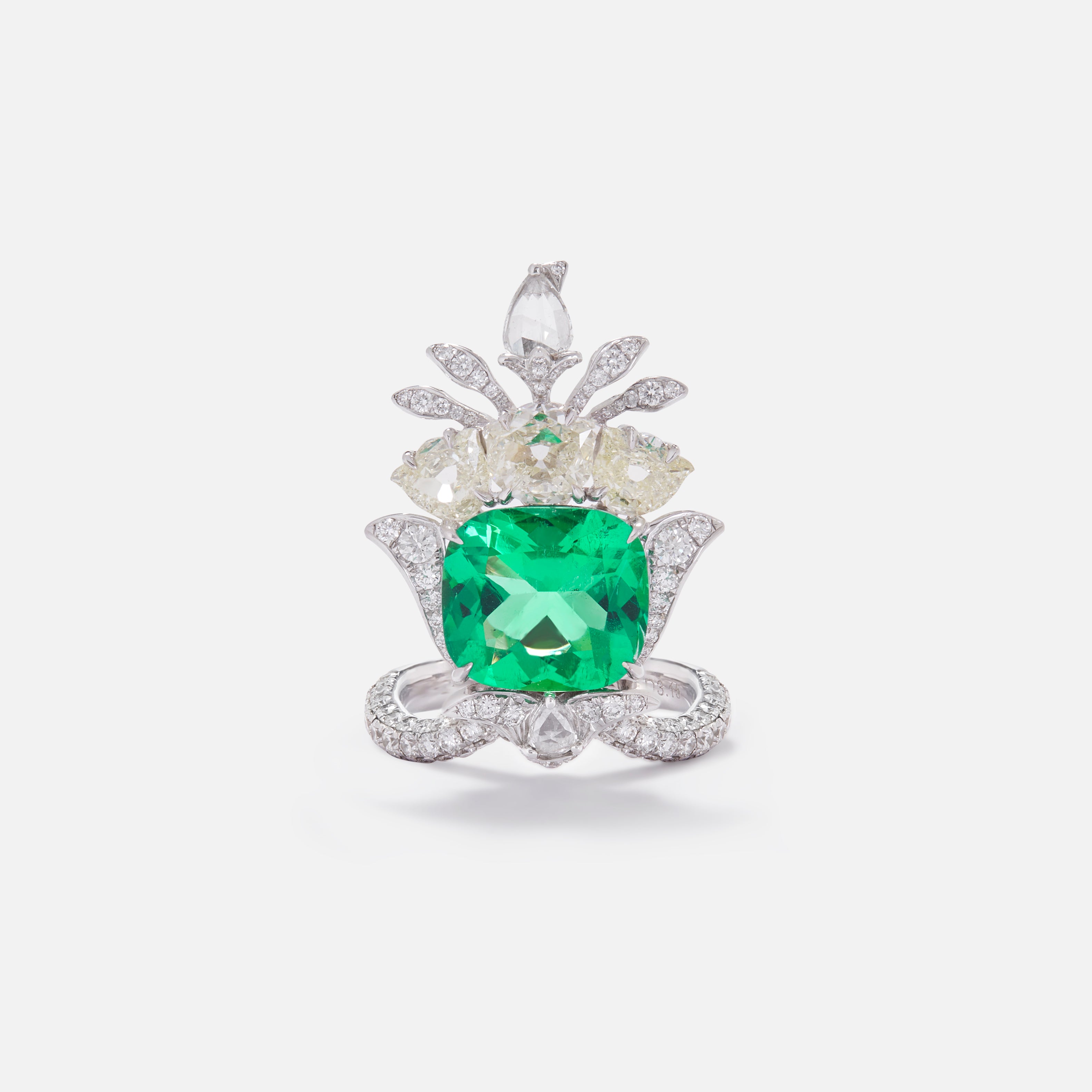 Crown jewel ring with large emerald set with rose cut diamonds