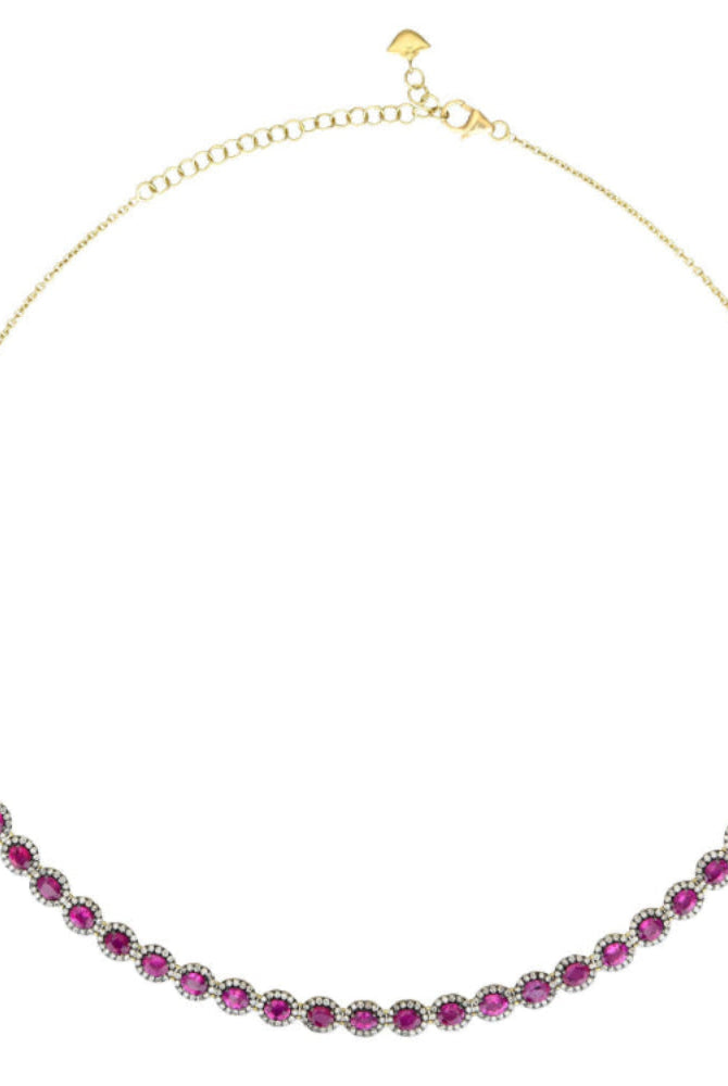 Gold necklace with pink gemstones on a white background