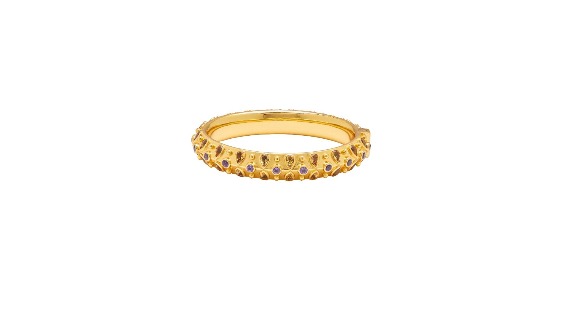 Gold bangle with embedded purple and yellow stones on a white background