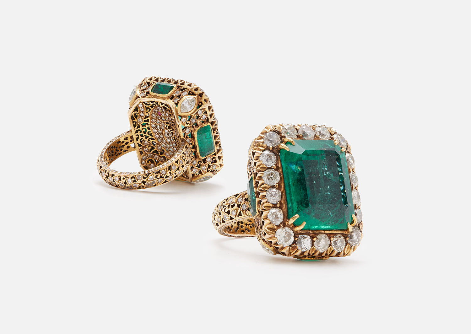 Ring with large dark emerald in our signature jali setting with a hidden parrot motif set in 18K yellow gold and diamonds