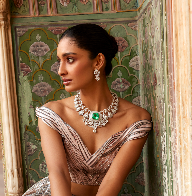 Indian model wears Amrapali's diamond and emerald necklace with diamond earrings.