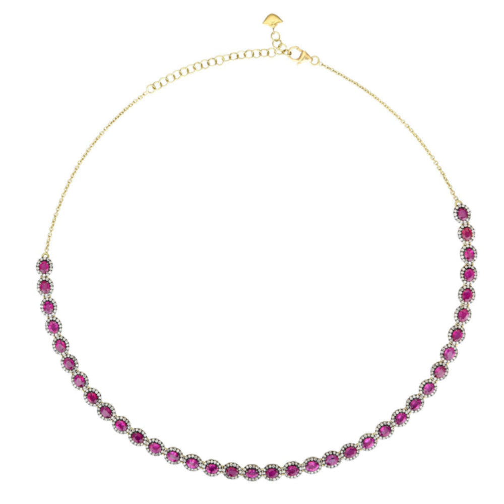 Gold necklace with pink gemstones on a white background
