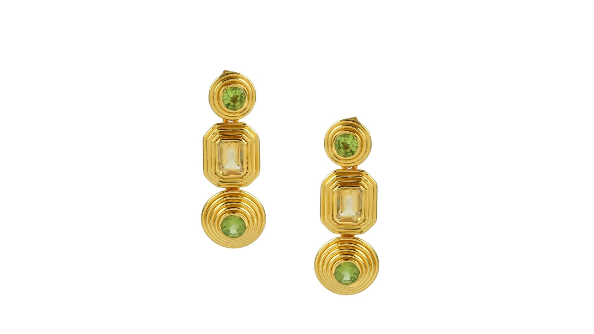 Gold cascade earrings with green and yellow gemstones on a white background