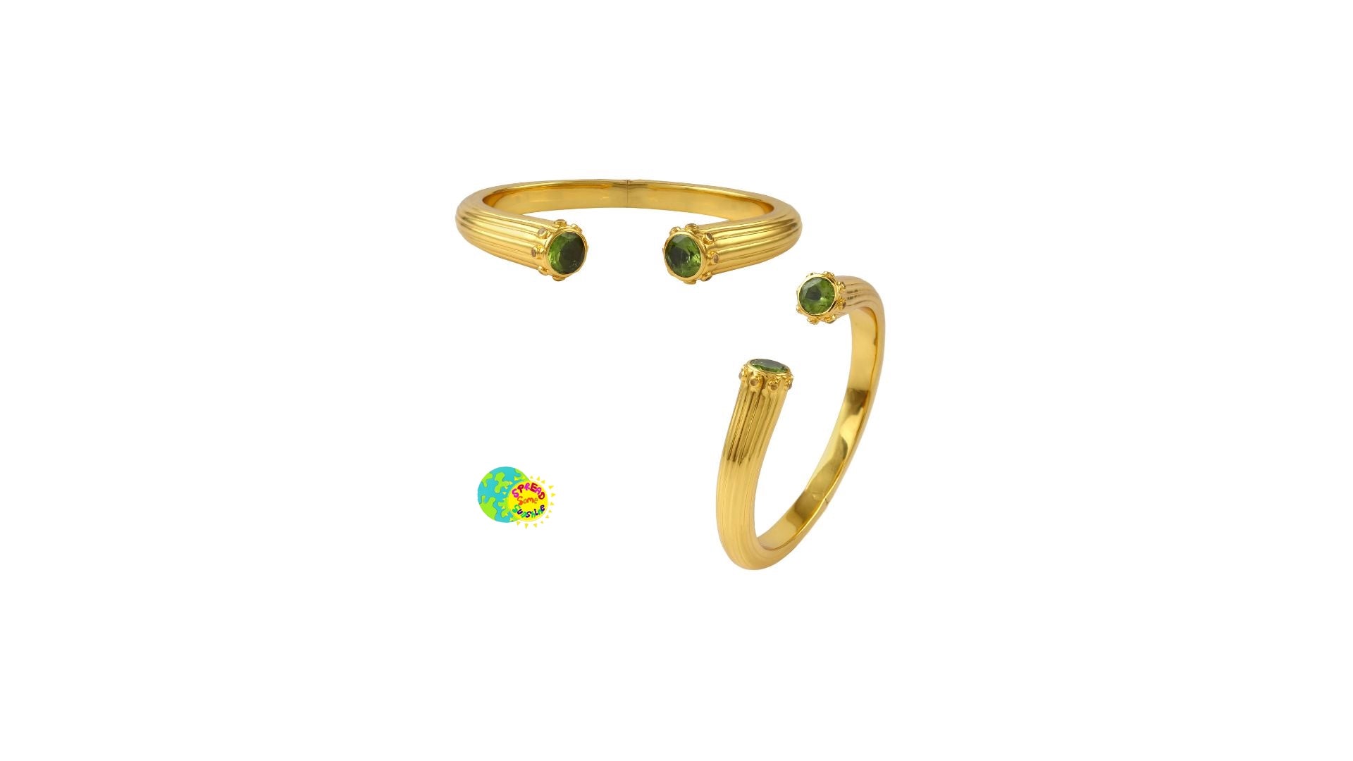Gold cuff bangle with green and yellow gemstones on a white background